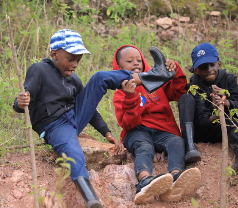 Children from Oakdale Brook Youth Mentorship Camp hiking outdoors for team bonding and adventure