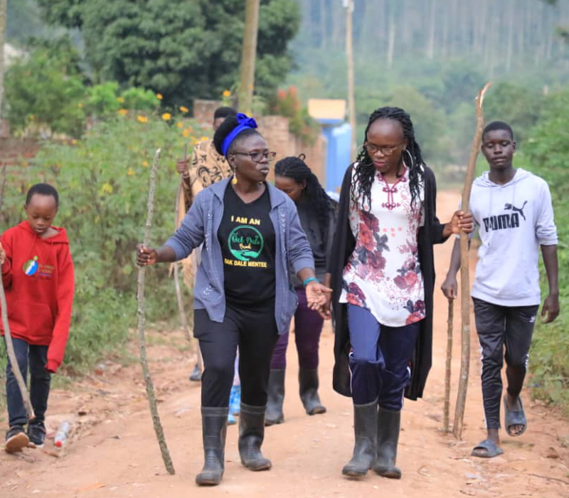 Oakdale Brook Youth Mentorship Camp counselor guiding children in team-building exercises to develop leadership and social skills