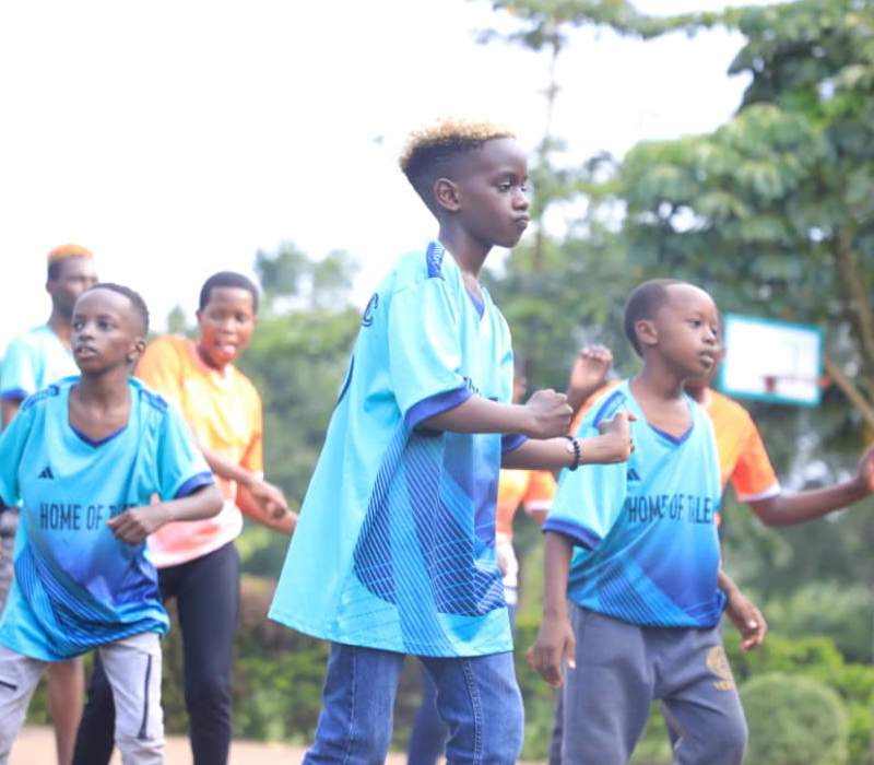 Oakdale Brook Youth Mentorship Camp children engaging in team-building activities and dance to promote confidence and teamwork